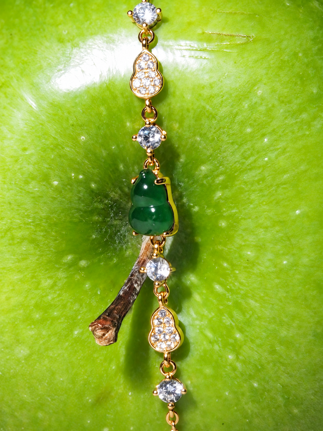 Held Close green jadeite Hulu bracelet with gold-tone chain by ANAM CARA