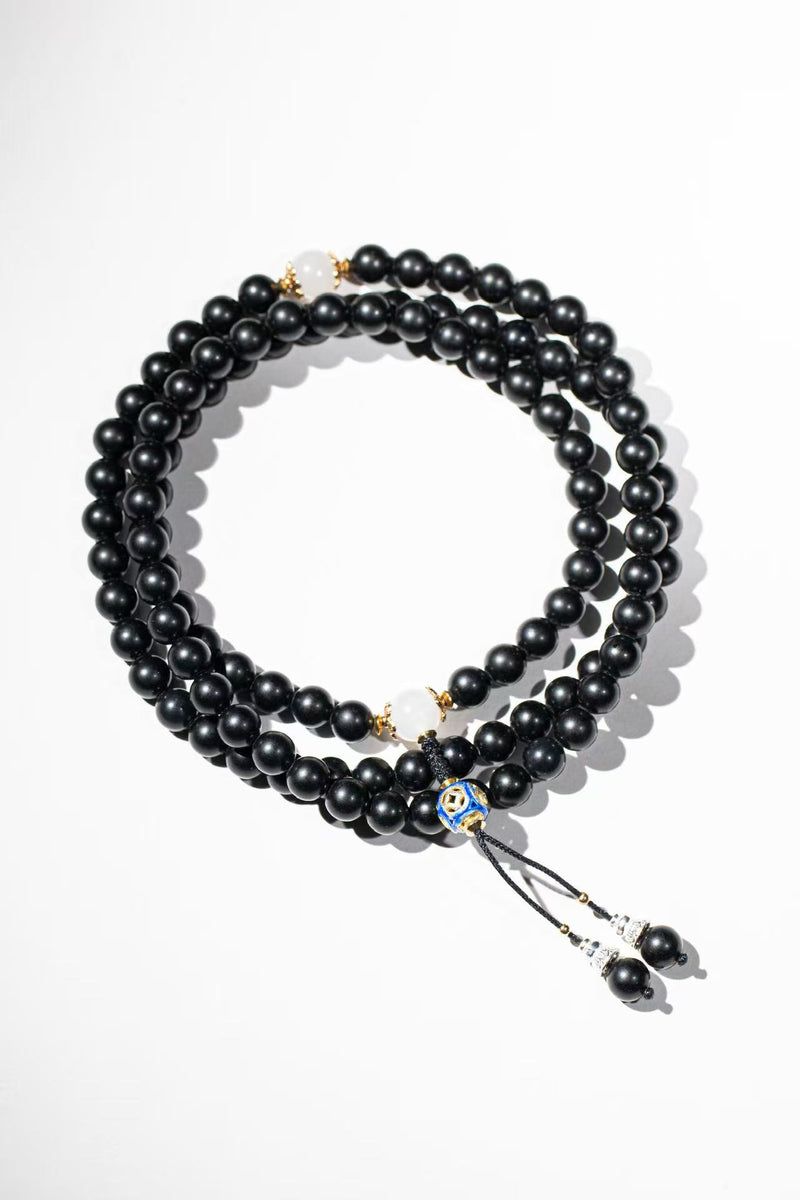 The piece that started it all. A 108-bead mala, reimagined as something you'd actually wear every day.